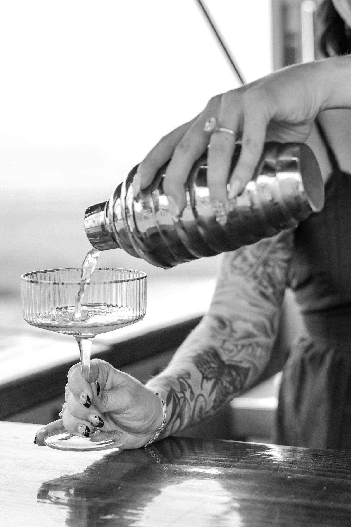 Bartenders sharing a laugh behind the mobile bar counter$