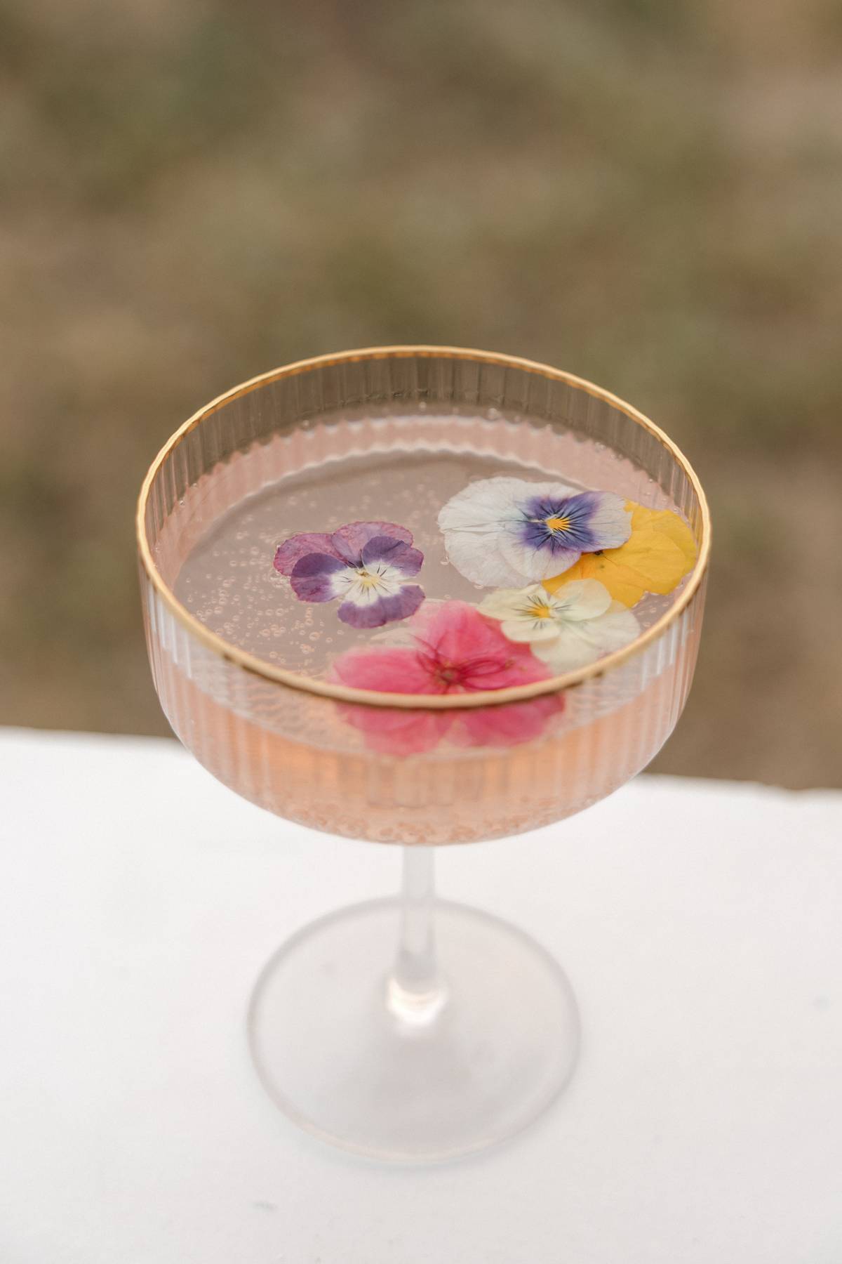Detail of a cocktail shaker and glassware on the bar counter$
