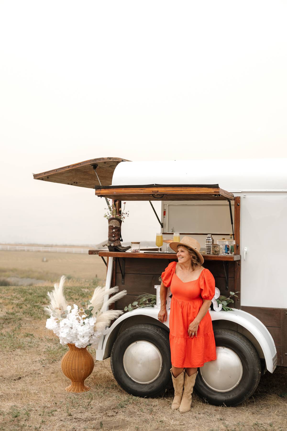 Bartender mixing a drink at the trailer bar counter$