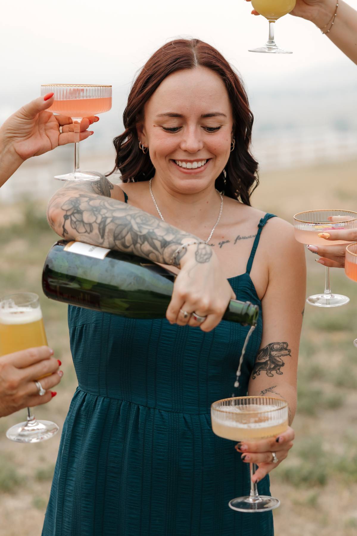Guests enjoying cocktails beside the mobile bar trailer$